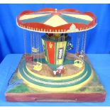 A Painted Wood Electric Chair-O-Planes Toy, also known as a Swing Carousel. Electric operated,