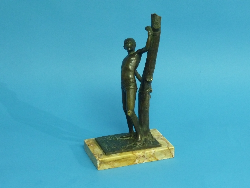 An early 20th century bronze figure of a chained slave by W. Adrian, the young man with his hands