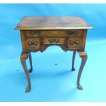 A Georgian style walnut Lowboy, of traditional form, with cabriole legs and hoof feet, 25in (63.5cm)