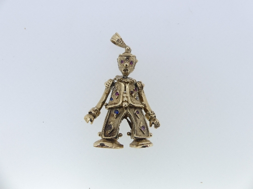 An articulated 9ct gold 'Clown' Pendant, the body set with small red, white and blue pastes, the
