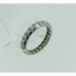 A diamond Eternity Ring, fully set with 21 circular stones, all mounted in unmarked white metal,