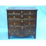 An 18th century oak Carolean-style Chest of Drawers, the rectangular top above four drawers with