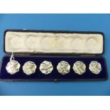 A cased set of six Edwardian silver Buttons, two by Mappin & Webb, four by Henry Matthews,