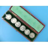 A cased set of six Edwardian silver Buttons, by William M. Hayes, hallmarked Birmingham, 1901/2,