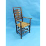 A late 19th century Lancashire oak ladder-back Armchair, with rope seat.