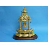 A French Empire ornate gilt-metal pillar Mantel Clock, with stand and glass dome, the circular