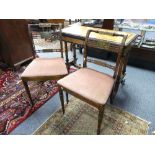 A pair of Victorian Sheraton revival side chairs, painted with putti and flowers, with cane seats