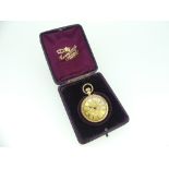 An ornate 14ct gold lady's Pocket Watch, marked "14K", the foliate engraved gilt dial with black