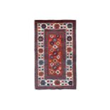 AN ANTIQUE KAZAK RUG, SOUTH CAUCASUS approx: 7ft.7in. x 4ft.6in.(231cm. x 137cm.) Very good