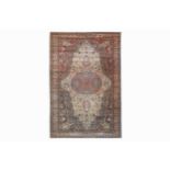 A FINE ANATOLIAN CARPET, TURKEY approx: 9ft.11in. x 6ft.8in.(302cm. x 204cm.) The ivory field with