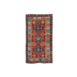 AN ANTIQUE AKSTAFA RUG, SOUTH-EAST CAUCASUS approx: 7ft.7in. x 4ft.(231cm. x 122cm.) The rust