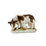 A MEISSEN PORCELAIN MINIATURE MODEL OF A COW