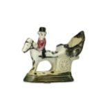 A RARE STAFFORDSHIRE POTTERY MODEL OF A HORSE-DRAWN CARRIAGE