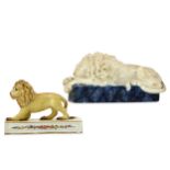 TWO CERAMIC MODELS OF LIONS