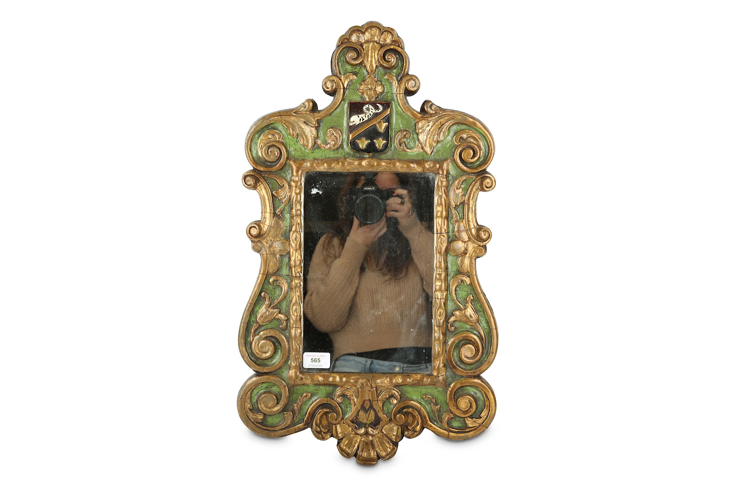 A Continental Baroque style green painted and parcel gilt mirror
