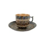 A late 19th Century Doulton Lambeth stoneware cup and saucer