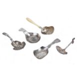 A William IV silver fiddle pattern caddy spoon and others