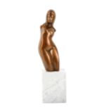 A contemporary bronze sculpture of a female nude