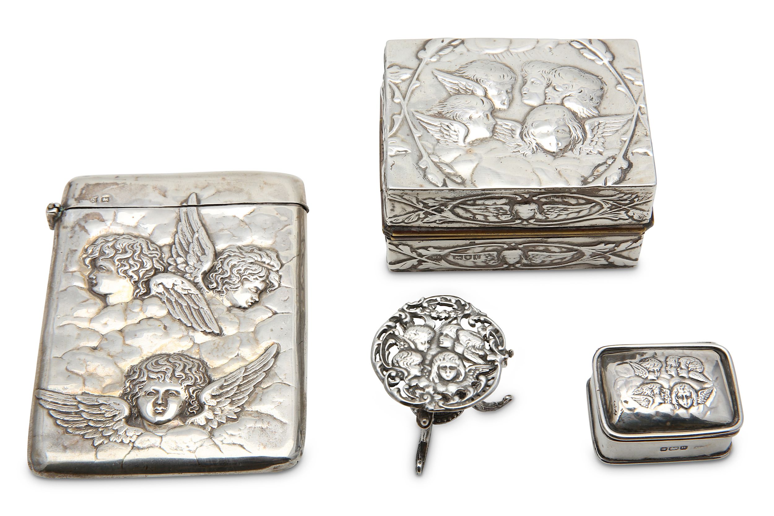 A mixed group of sterling silver Vertu items, decorated with cherubs