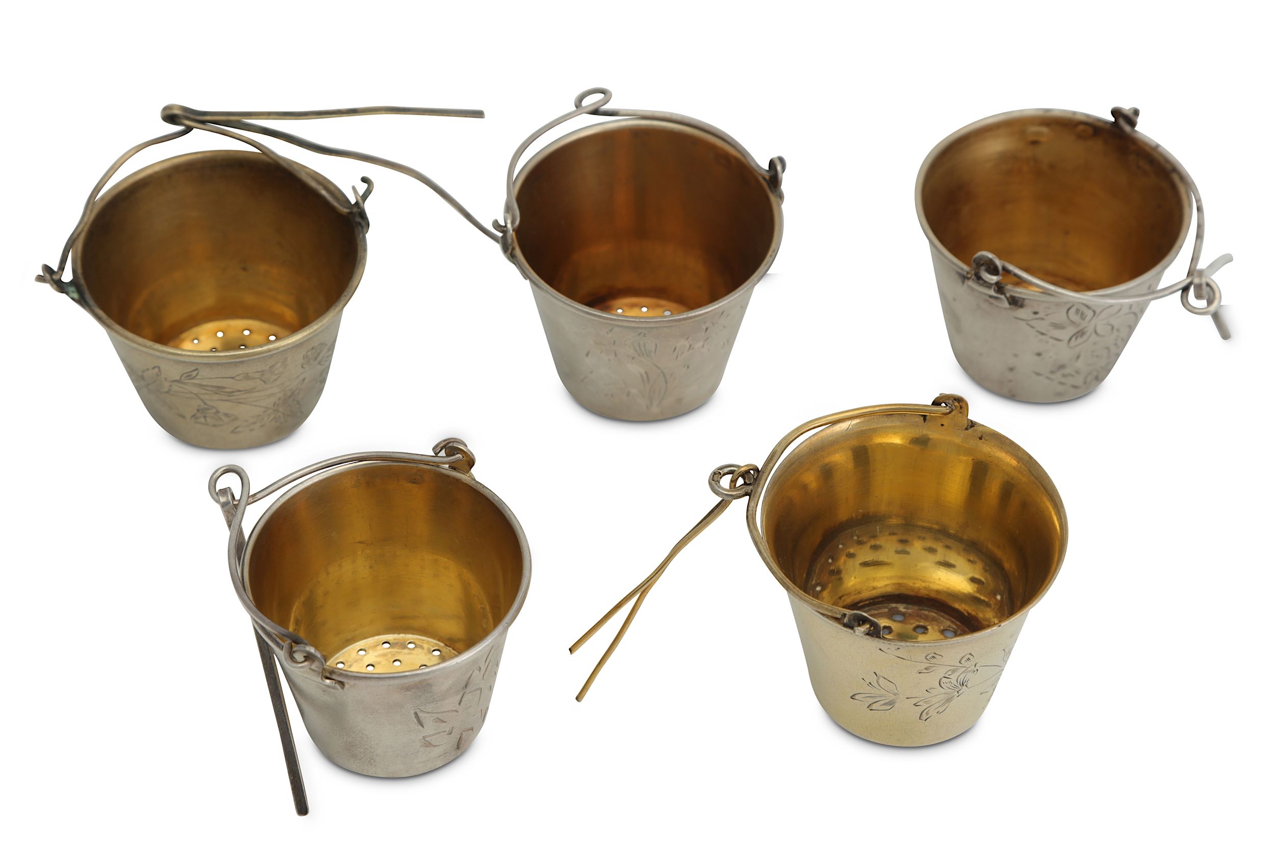 A mixed group of five 20th century Russian Soviet Era silver and silver-gilt tea strainers