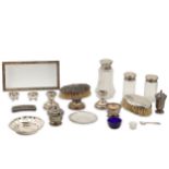 A mixed group of assorted sterling silver items, including a three piece cruet set