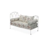 A white painted cast iron single bed frame