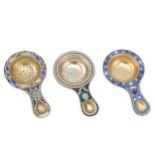 A mixed group of three 20th century Russian Soviet Era silver-gilt and enamel tea strainers