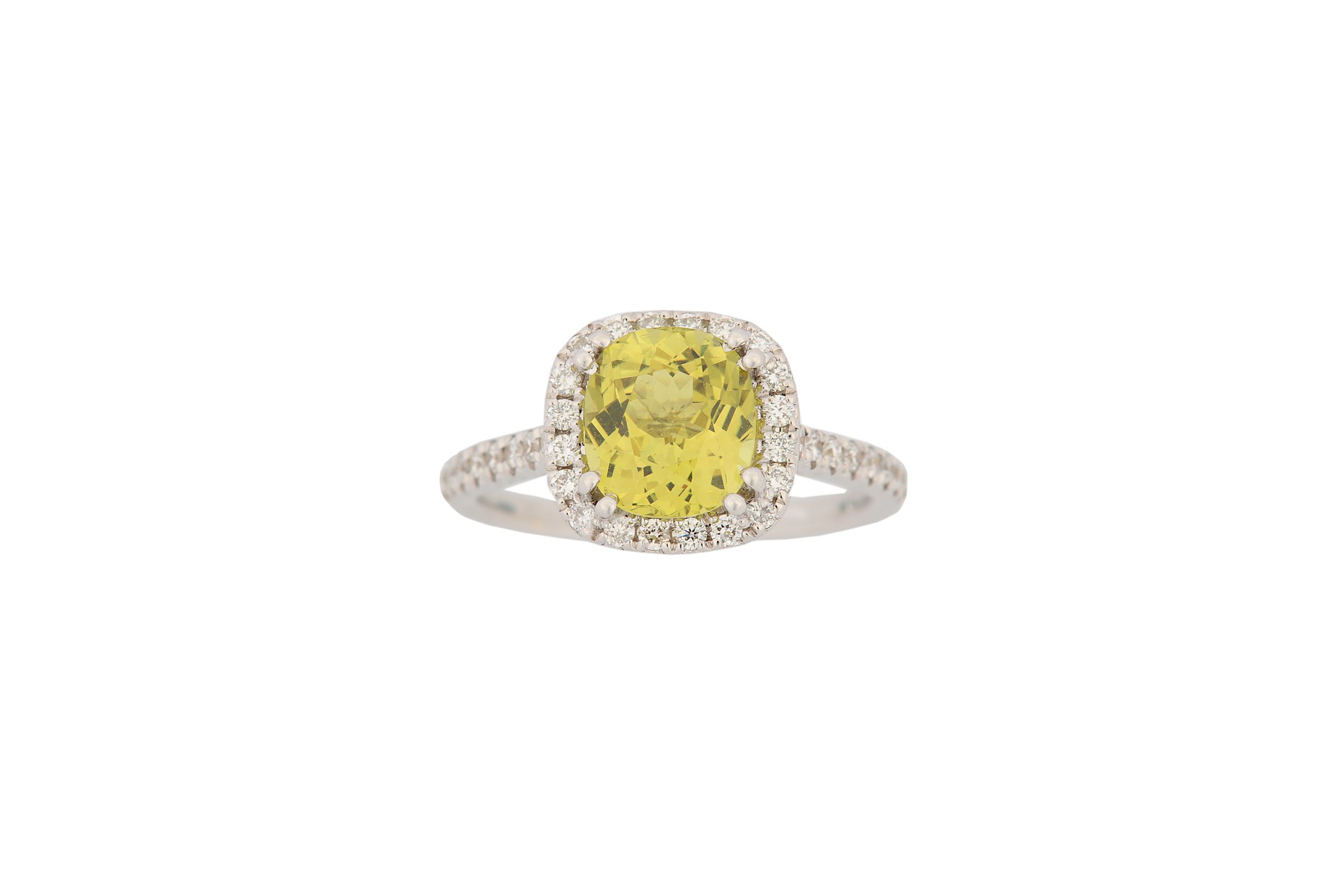 A yellow chrysoberyl and diamond cluster ring