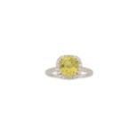 A yellow chrysoberyl and diamond cluster ring