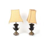 A pair of early 20th Century bronzed and gilt metal mounted table lamps