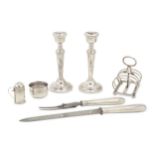 A mixed group of sterling silver items including a pair of candlesticks