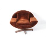 A 1970s brown velvet upholstered swivel chair