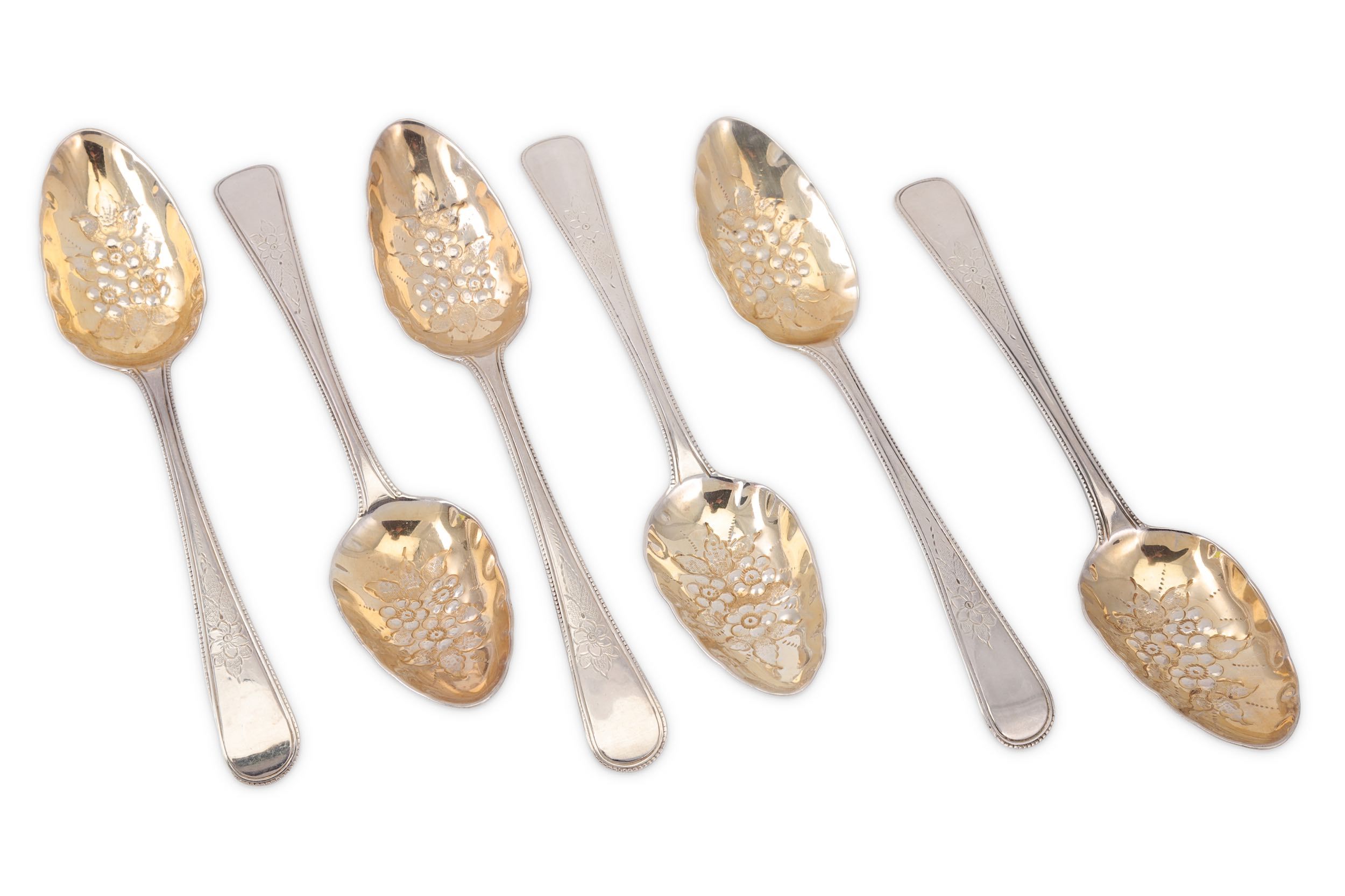 A set of six l George III sterling silver berry spoons, London 1794