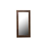 A large modern wall mirror with a bevelled plate and beige shagreen effect frame