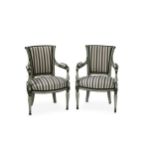 A pair of Regency style green painted armchairs and another