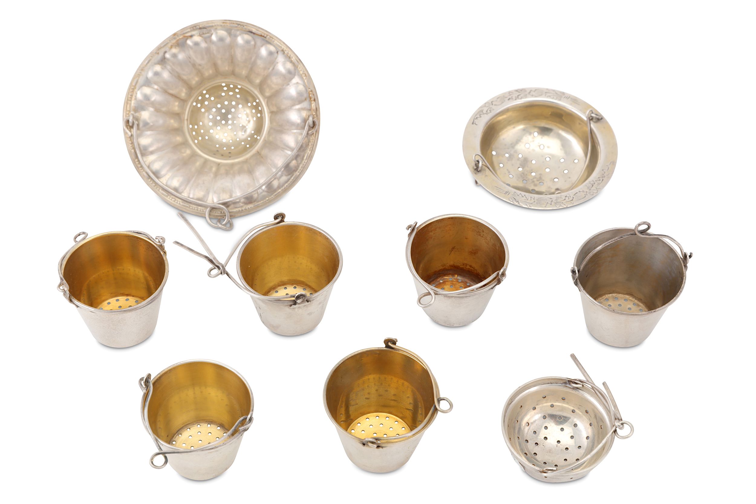 A mixed group of nine 20th century Russian Soviet era silver tea strainers