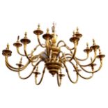 A 20th Century Dutch style multi arm sixteen branch brass chandelier