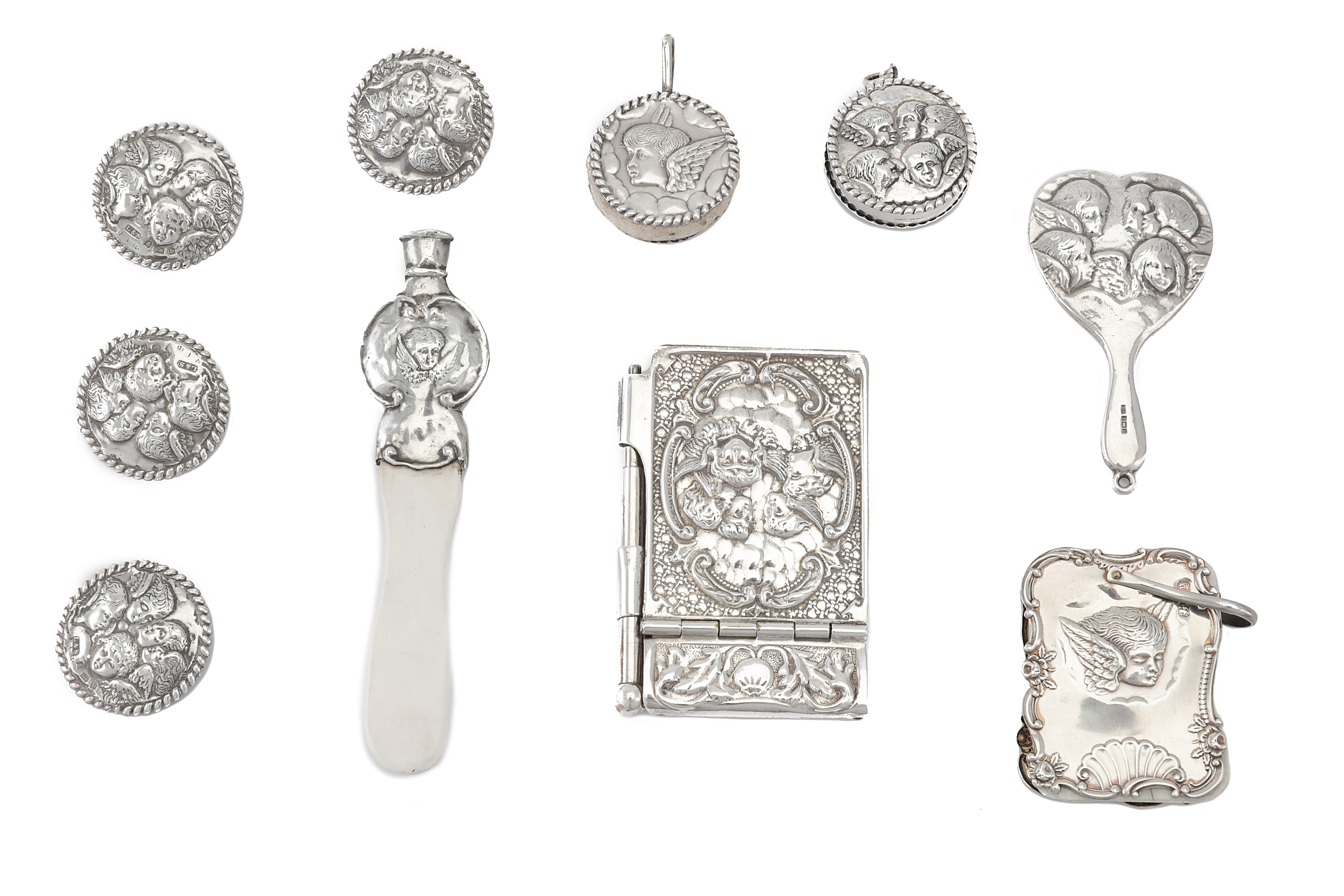 A mixed group of silver objects of Vertu, decorated with cherubs