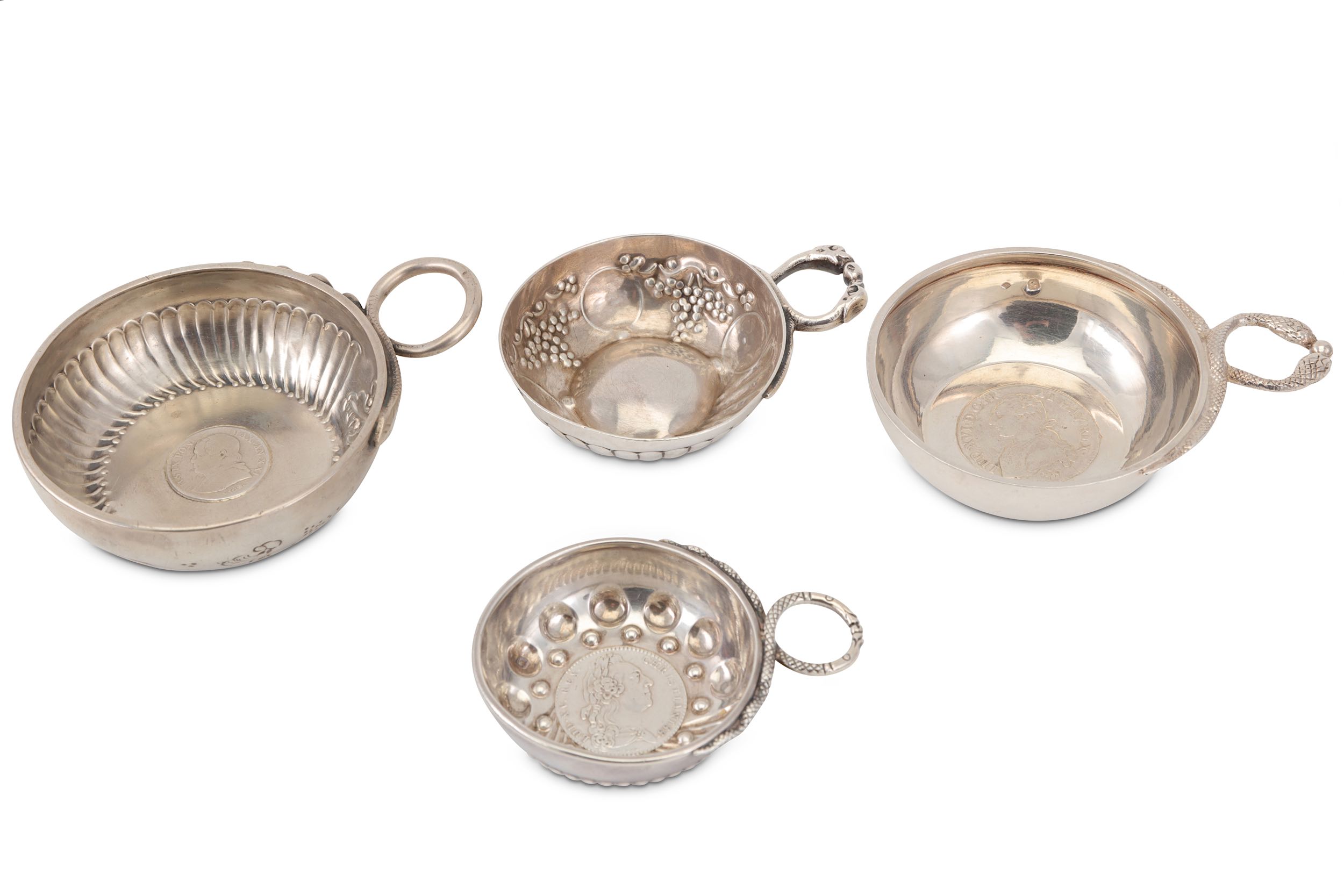 A mixed group of four French silver snake handled wine tasters