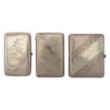 A mixed group of three Russian 84 zolotnik (875 standard) silver cigarette cases