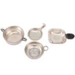 A mixed group of silver tea strainers and wine tasters