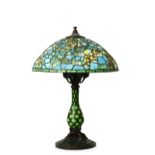 A TIFFANY STYLE BRONZE TABLE LAMP.