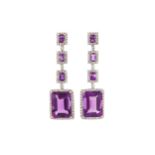 A pair of amethyst and diamond pendent earrings