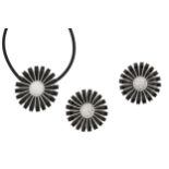 A black enamel 'Daisy' pendant and earclips, by Georg Jensen