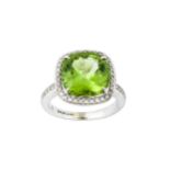 A peridot and diamond cluster ring