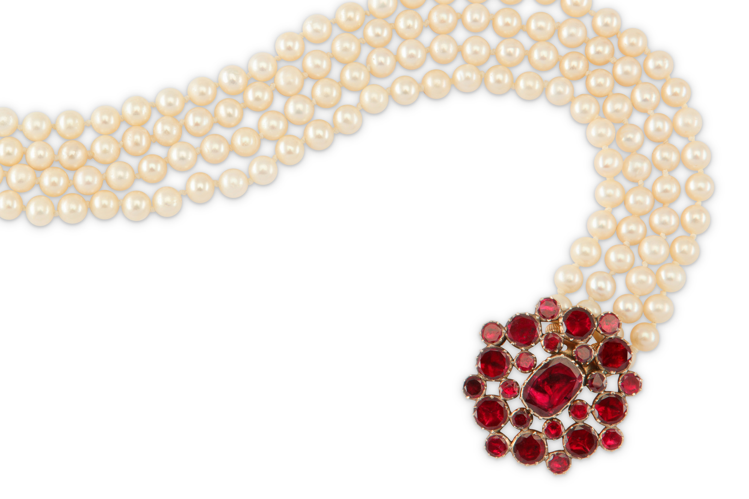 A cultured pearl necklace with a 19th century garnet clasp