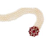 A cultured pearl necklace with a 19th century garnet clasp