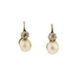 A pair of pearl and diamond earrings