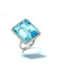 An aquamarine and diamond dress ring