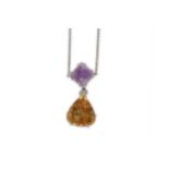 A citrine and amethyst pendant necklace